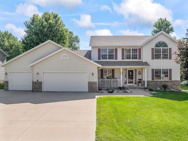 1405 17th Dr SW, Austin, MN 55912 - view of front of house featuring a porch, brick siding, driveway, an attached garage, and a front lawn