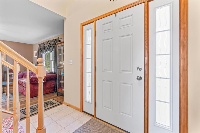 1405 17th Dr SW, Austin, MN 55912 - foyer featuring stairs and light tile patterned floors