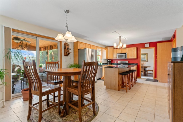 1405 17th Dr SW, Austin, MN 55912 - dining room featuring a chandelier, light tile patterned flooring, and a textured ceiling