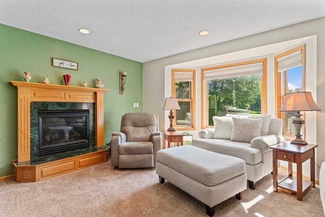 1405 17th Dr SW, Austin, MN 55912 - carpeted living room featuring a premium fireplace, a textured ceiling, and recessed lighting