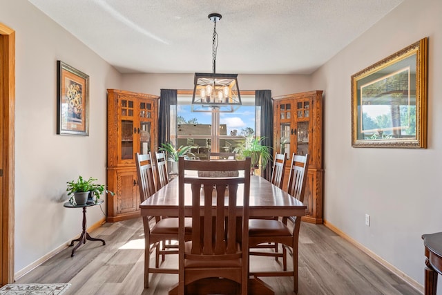 1405 17th Dr SW, Austin, MN 55912 - dining room featuring a chandelier and light wood-type flooring