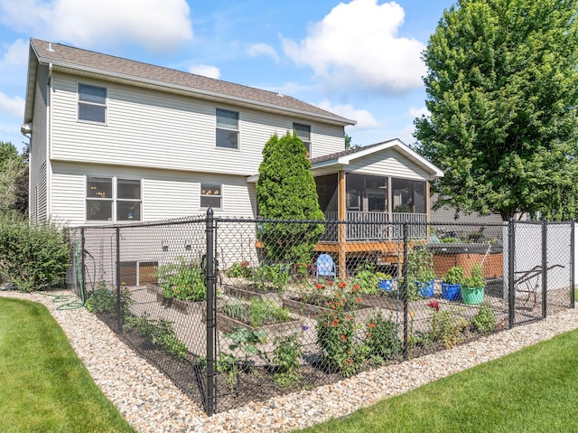 1405 17th Dr SW, Austin, MN 55912 - rear view of property featuring a vegetable garden and a sunroom