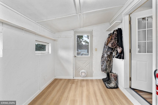 W10429 Hinker Rd, Foster Twp, WI 54493 - foyer with vaulted ceiling, wood finished floors, and plenty of natural light