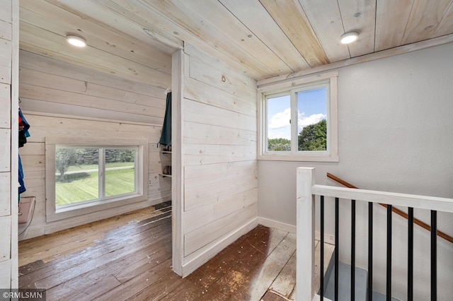 W10429 Hinker Rd, Foster Twp, WI 54493 - corridor with hardwood / wood-style floors, plenty of natural light, an upstairs landing, wooden ceiling, and wooden walls