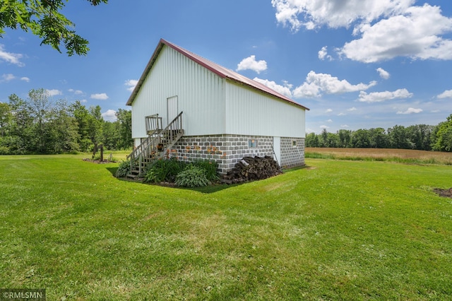 W10429 Hinker Rd, Foster Twp, WI 54493 - view of side of property with a lawn, a pole building, and an outdoor structure