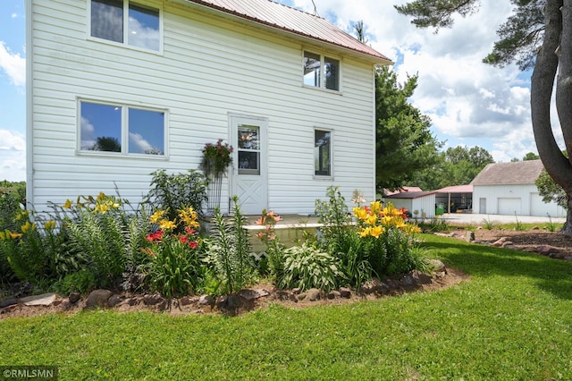 W10429 Hinker Rd, Foster Twp, WI 54493 - rear view of property featuring a yard and a metal roof