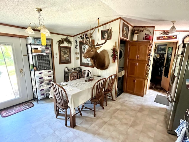 31700 Cherry Lake Rd, Ogema, MN 56569 - dining area with a textured ceiling, light floors, and ornamental molding