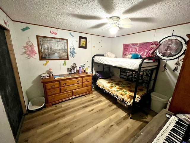 31700 Cherry Lake Rd, Ogema, MN 56569 - bedroom featuring wood finished floors, a textured ceiling, a ceiling fan, and crown molding