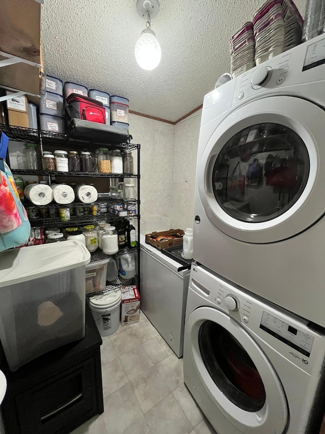 31700 Cherry Lake Rd, Ogema, MN 56569 - laundry room featuring stacked washer / dryer, light tile patterned flooring, and a textured ceiling