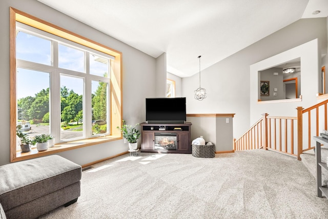 911 Hazelwood Ct, Buffalo, MN 55313 - carpeted living area with lofted ceiling and baseboards