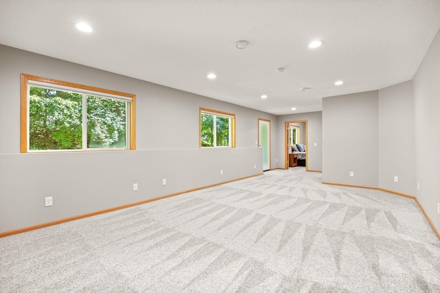 911 Hazelwood Ct, Buffalo, MN 55313 - empty room with recessed lighting and light carpet