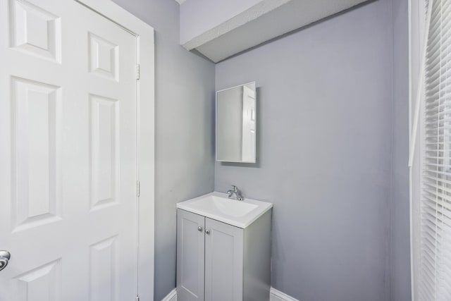 1711 Newton Ave N, Minneapolis, MN 55411 - bathroom with vanity and baseboards