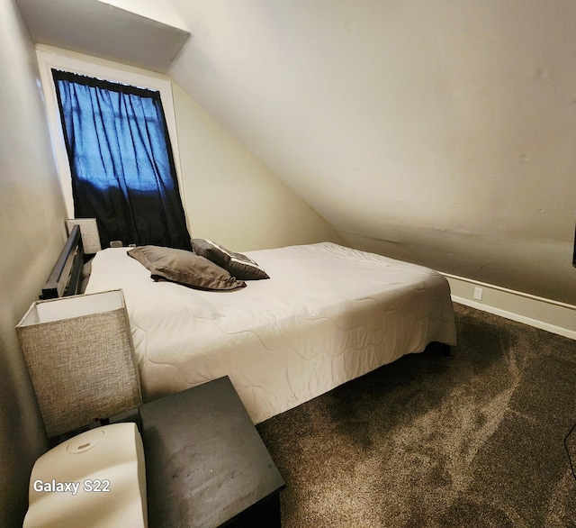1033 Mark St, Winona, MN 55987 - carpeted bedroom with lofted ceiling and baseboards