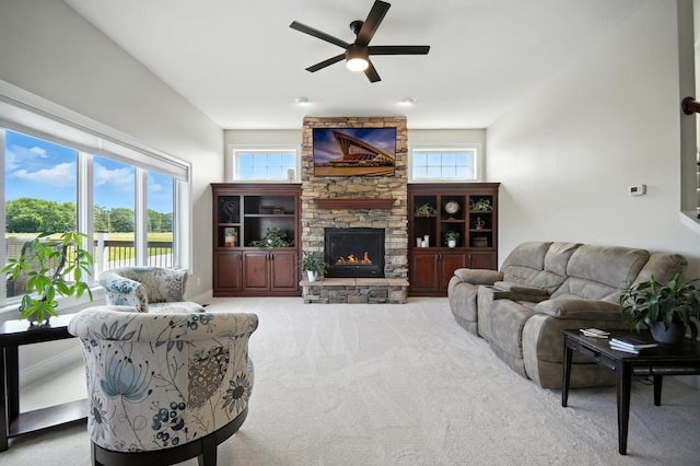 1570 Wood Duck Ln NE, Owatonna, MN 55060 - carpeted living area featuring ceiling fan and a fireplace