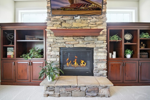 1570 Wood Duck Ln NE, Owatonna, MN 55060 - living area with light colored carpet and a stone fireplace