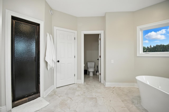 1570 Wood Duck Ln NE, Owatonna, MN 55060 - bathroom featuring a freestanding tub, marble finish flooring, and a shower stall