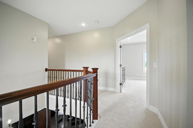 1570 Wood Duck Ln NE, Owatonna, MN 55060 - corridor with an upstairs landing, light colored carpet, and recessed lighting