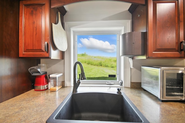 1570 Wood Duck Ln NE, Owatonna, MN 55060 - kitchen featuring a sink and stainless steel microwave
