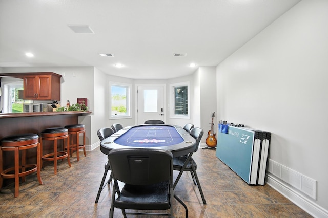 1570 Wood Duck Ln NE, Owatonna, MN 55060 - dining space with plenty of natural light, stone finish flooring, and recessed lighting