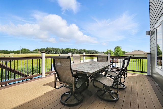 1570 Wood Duck Ln NE, Owatonna, MN 55060 - deck featuring outdoor dining space and a yard