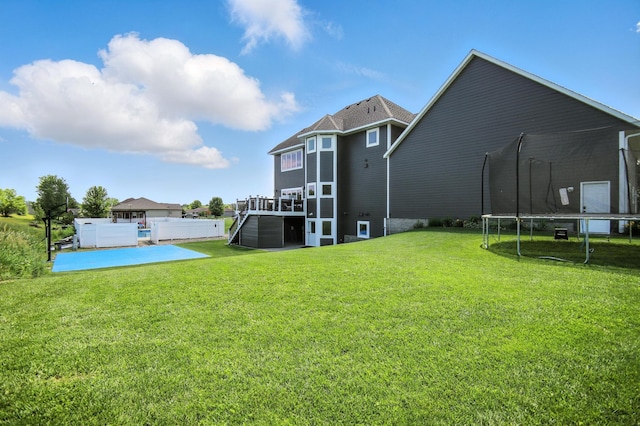 1570 Wood Duck Ln NE, Owatonna, MN 55060 - rear view of property with a trampoline and a patio area