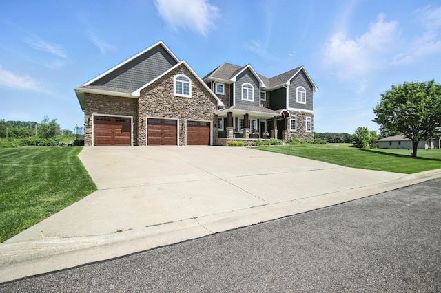1570 Wood Duck Ln NE, Owatonna, MN 55060 - craftsman house with stone siding, a front lawn, driveway, and a garage
