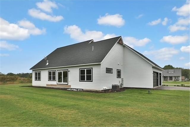 7591 255th St, Wyoming, MN 55092 - back of property with a garage, a yard, and driveway