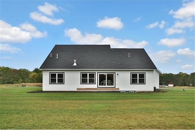 7591 255th St, Wyoming, MN 55092 - rear view of property with a lawn
