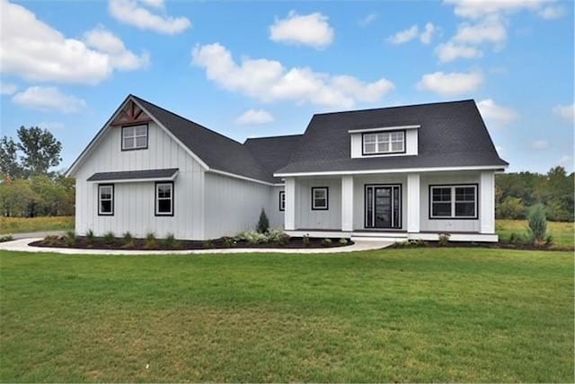 7591 255th St, Wyoming, MN 55092 - view of front of property with a front yard, a porch, and board and batten siding