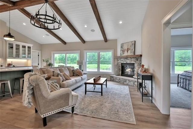 7591 255th St, Wyoming, MN 55092 - living area with light wood-style flooring, a stone fireplace, and recessed lighting