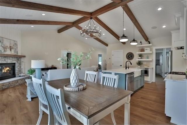 7591 255th St, Wyoming, MN 55092 - dining space with a fireplace, wood finished floors, a chandelier, and recessed lighting