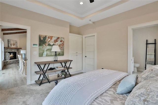 7591 255th St, Wyoming, MN 55092 - bedroom with a fireplace, carpet floors, connected bathroom, and recessed lighting