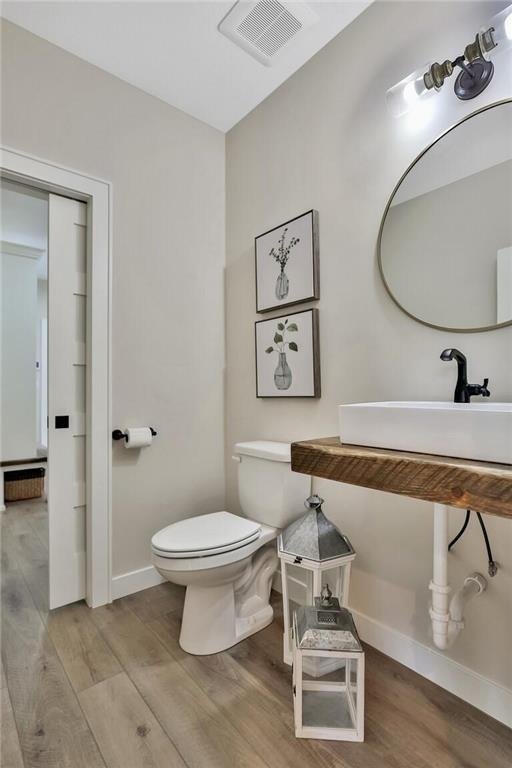7591 255th St, Wyoming, MN 55092 - bathroom with toilet and wood finished floors
