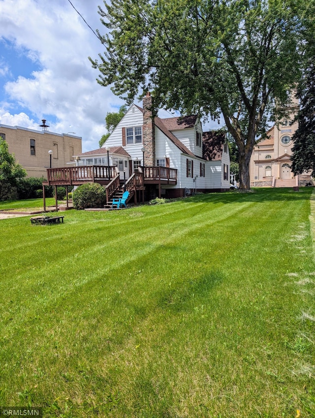 711 Main St N, Browerville, MN 56438 - view of green lawn featuring a deck