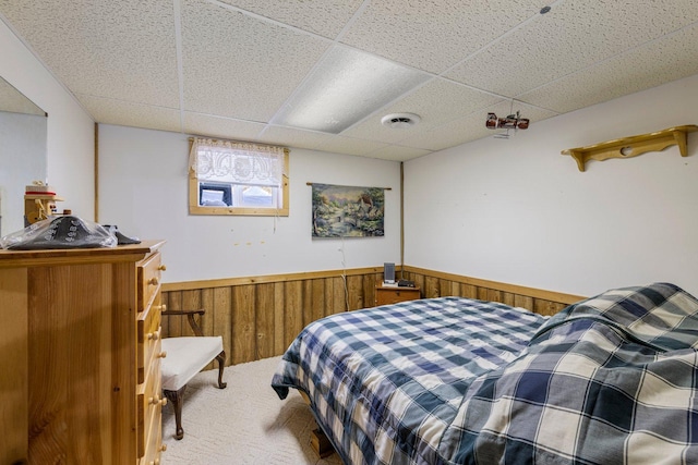 24621 Long Lake Rd, Bigfork, MN 56628 - carpeted bedroom with a drop ceiling, wainscoting, and wood walls