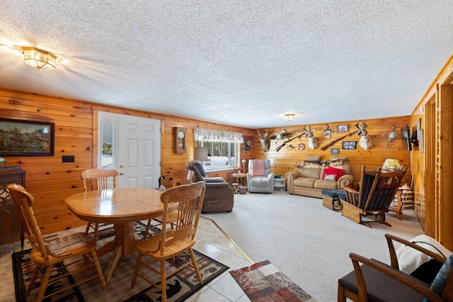 24621 Long Lake Rd, Bigfork, MN 56628 - dining room featuring wooden walls and a textured ceiling