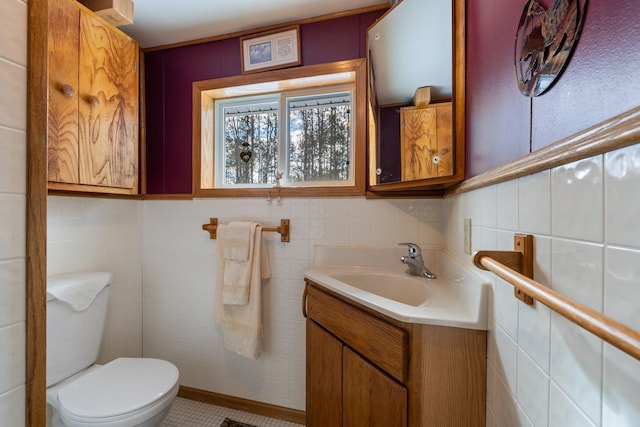 24621 Long Lake Rd, Bigfork, MN 56628 - bathroom with vanity, tile walls, and tile patterned flooring