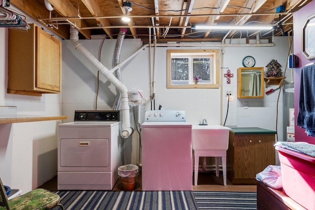 24621 Long Lake Rd, Bigfork, MN 56628 - laundry room with washer and dryer, cabinet space, and water heater