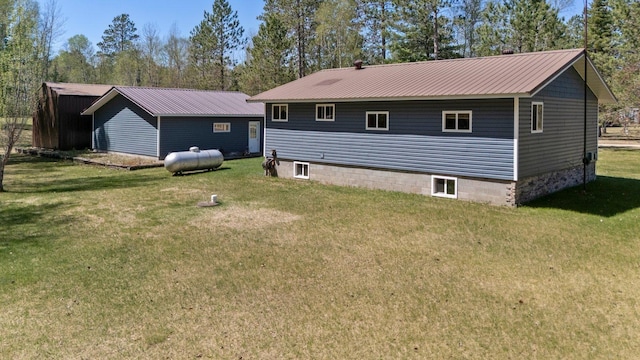 24621 Long Lake Rd, Bigfork, MN 56628 - back of house with a yard and a metal roof