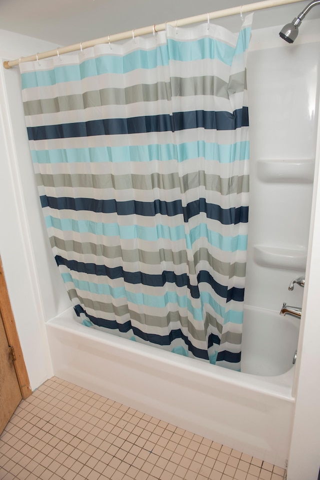 304 Pearl St, Spring Valley, MN 55975 - bathroom featuring shower / bath combo with shower curtain and tile patterned floors