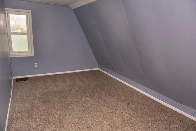 304 Pearl St, Spring Valley, MN 55975 - carpeted spare room with baseboards and lofted ceiling
