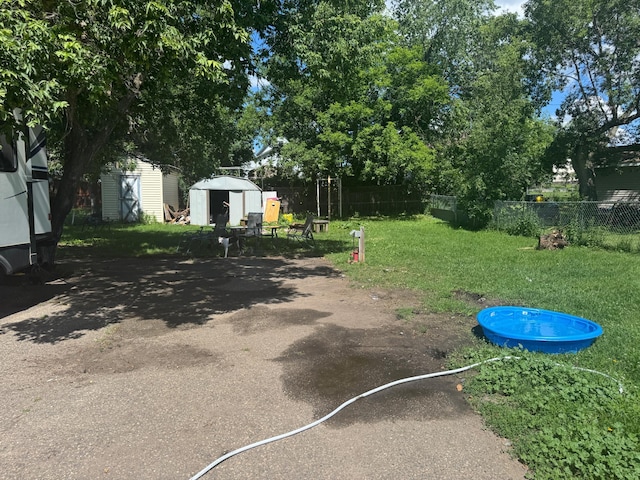 117 Maple Ave, Frazee, MN 56544 - view of yard featuring a storage shed