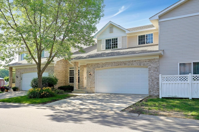 9633 Belmont Ln, Eden Prairie, MN 55347 - traditional home featuring a garage, driveway, a shingled roof, and brick siding