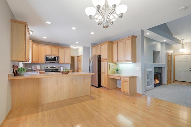 9633 Belmont Ln, Eden Prairie, MN 55347 - kitchen featuring appliances with stainless steel finishes, light brown cabinetry, light wood-style flooring, a peninsula, and recessed lighting