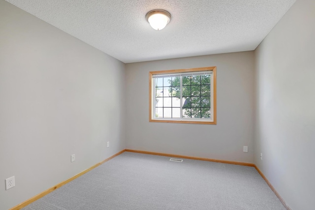 9633 Belmont Ln, Eden Prairie, MN 55347 - carpeted spare room with a textured ceiling and baseboards