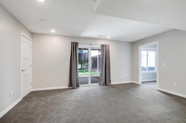 9633 Belmont Ln, Eden Prairie, MN 55347 - empty room featuring healthy amount of natural light, dark colored carpet, and recessed lighting