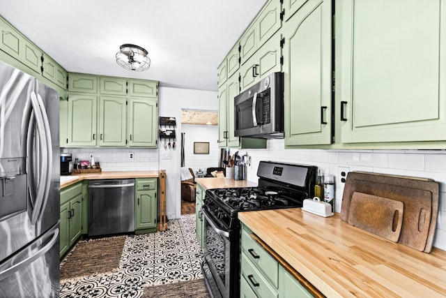 315 Ugstad Rd, Proctor, MN 55810 - kitchen featuring appliances with stainless steel finishes and green cabinetry
