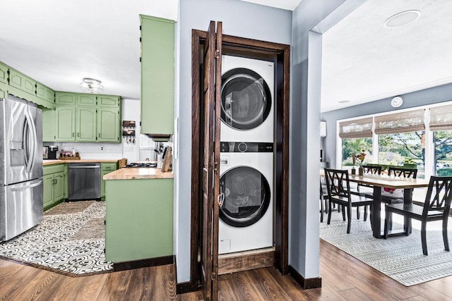 315 Ugstad Rd, Proctor, MN 55810 - laundry room with stacked washer and clothes dryer and dark wood finished floors