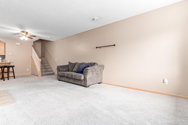 16418 Elm Creek Ln Unit 4027, Lakeville, MN 55044 - carpeted living room with stairway, ceiling fan, and a textured ceiling