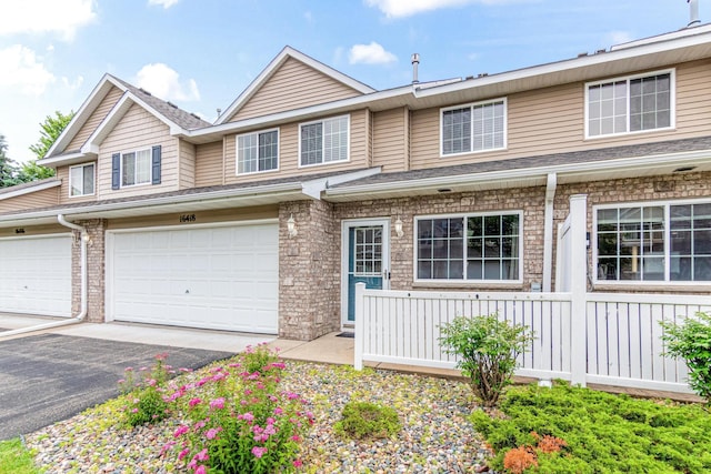 16418 Elm Creek Ln Unit 4027, Lakeville, MN 55044 - view of property with driveway and a garage
